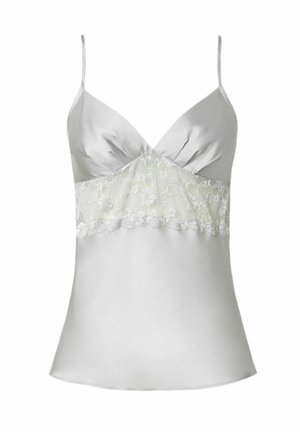 Silkkinen valkoinen toppi, jossa on säädettävät olkaimet, ja vyötäröllä on läpinäkyvä pitsikerros sekä monimutkaisia kukkakuoseja. Sujuva rakenne.