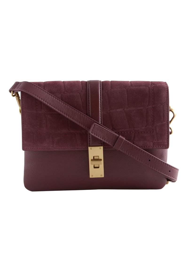 Burgundy handbag with a textured suede flap and smooth leather body, featuring a gold-tone clasp and adjustable strap.
