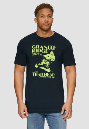 Black short-sleeve t-shirt with green graphic text and illustration, featuring "Granite Ridge" and "S. Oliver Trailhead, Jackson Hole USA."