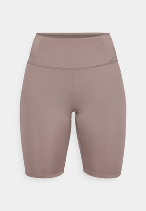 Pantaloni da ciclismo di colore taupe morbido, realizzati in tessuto elasticizzato. Presentano una vita alta con un cinturino liscio e un design senza cuciture.