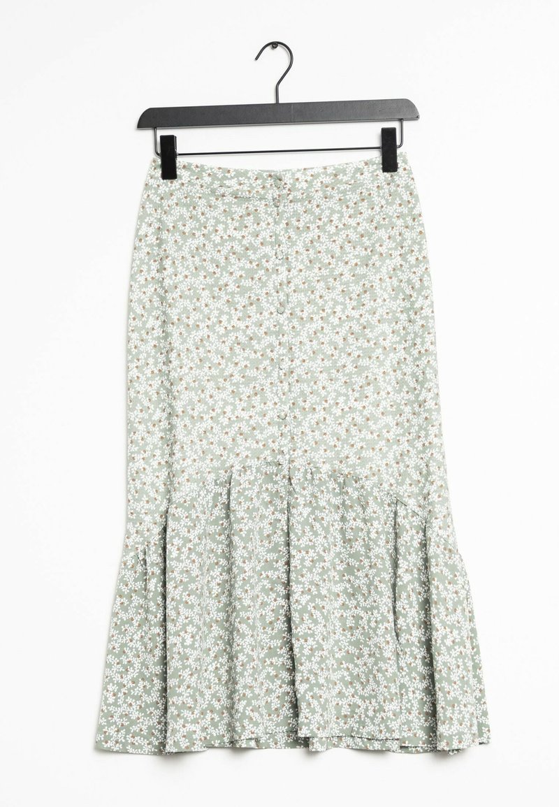 Jupe midi vert clair avec petit motif floral blanc et marron, détail bouton sur le devant et ourlet évasé, suspendue sur un cintre noir.