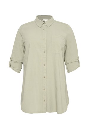 Camicia beige chiaro a maniche lunghe con bottoni frontali, tasca sul petto singola e maniche arrotolate fissate con linguette con bottoni.