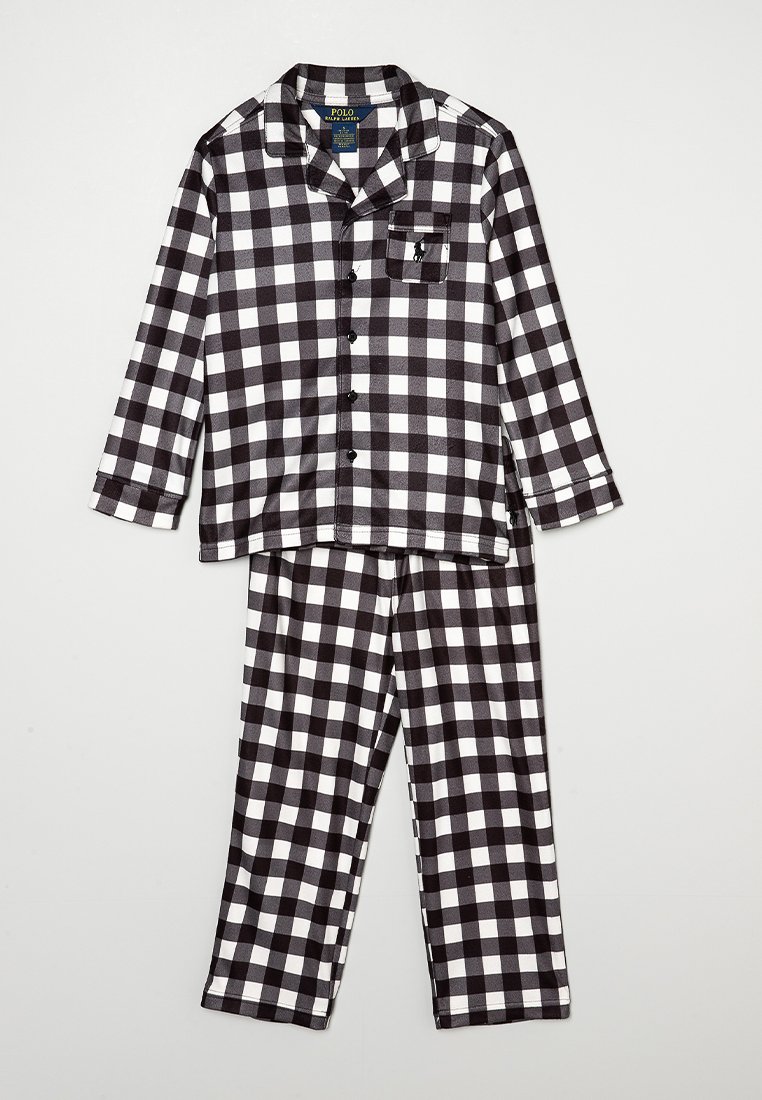 Ensemble de pyjama en coton à carreaux noir et blanc, comprenant une blouse à manches longues avec un col boutonné et une poche poitrine, ainsi qu'un pantalon assorti avec une taille élastique.
