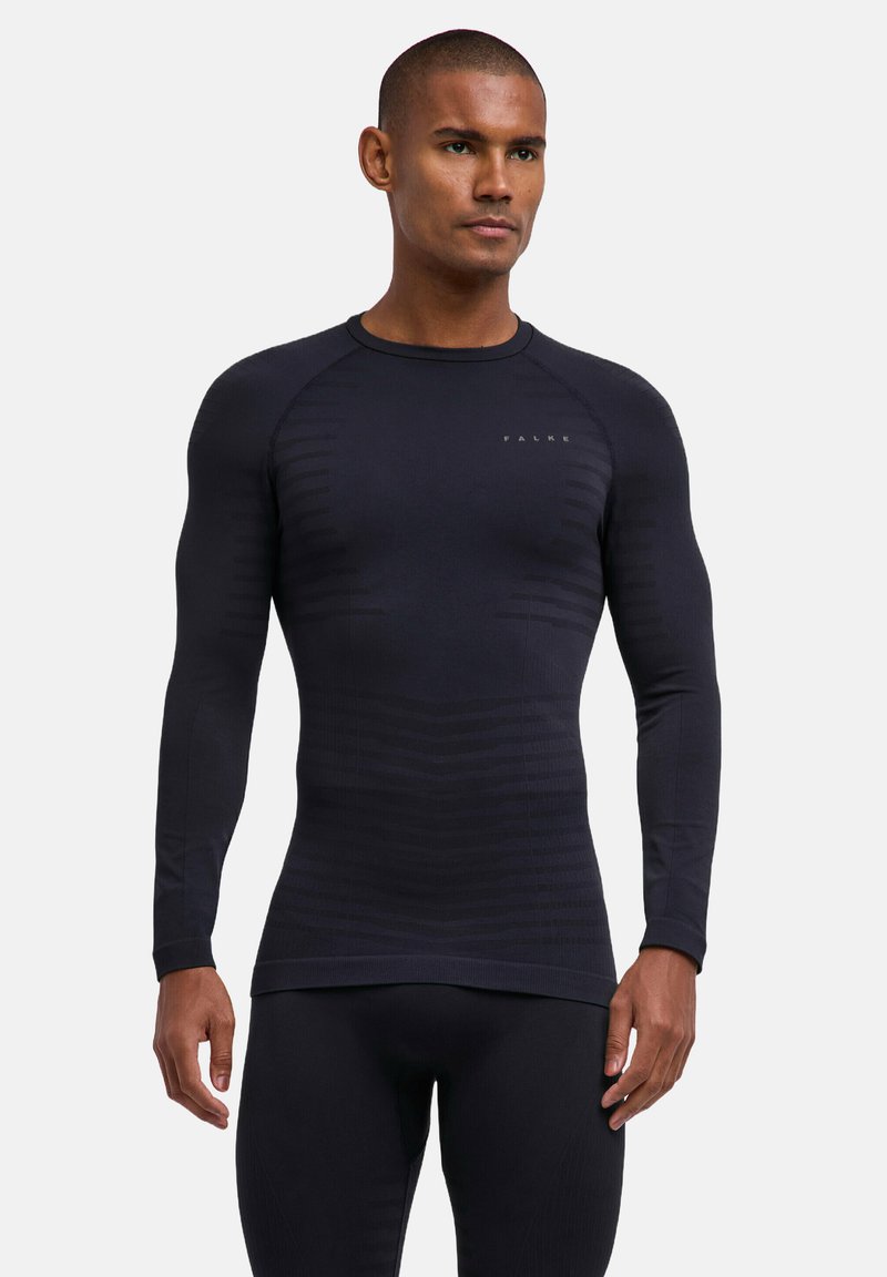Granatowa termiczna koszulka z długim rękawem, wykonana z teksturowanej tkaniny z delikatnym paskowanym wzorem; posiada okrągły dekolt i dopasowany krój.