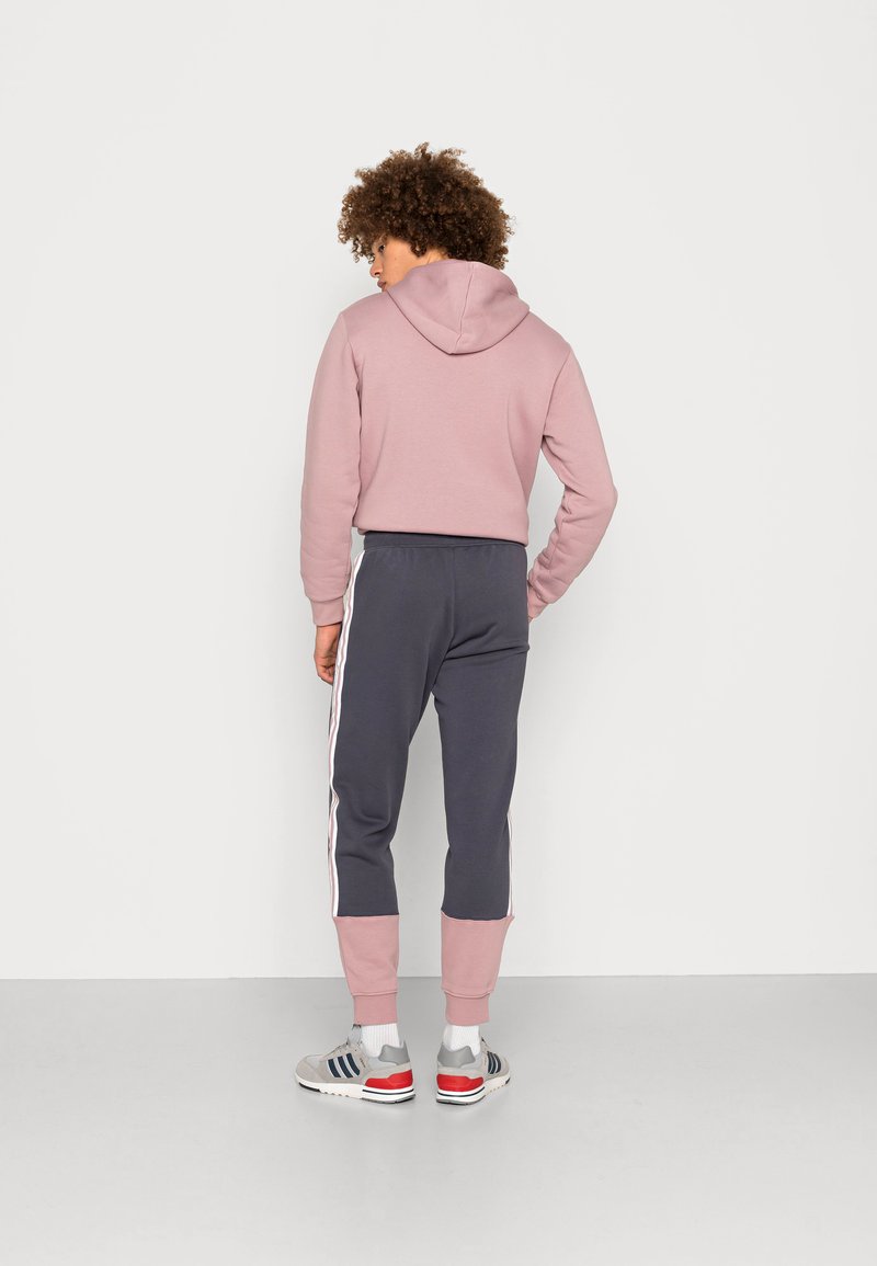 adidas Originals Teplákové kalhoty - shadow navy/magic mauve