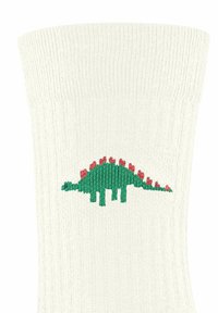 Białe skarpetki z prążkowanym wzorem, z zielonym i różowym motywem dinozaura, charakteryzujące się teksturowanym splotem. Dinozaur ma zaokrąglony kształt z kolcami.