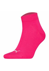 Calcetín rosa hasta el tobillo hecho de material elástico, con un puño acanalado y un logo blanco en la punta. Textura suave con un diseño sencillo.