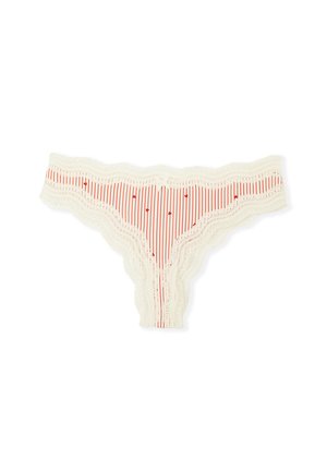 Lace-trimmed thong made of cream fabric with red vertical stripes and small red hearts, featuring a scalloped edge and bow detail.