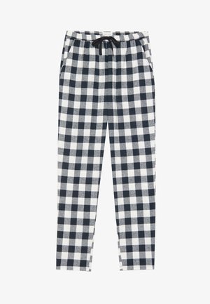Bawełniane spodnie dresowe z granatowo-białą kratką, elastycznym pasem ze sznurkiem regulacyjnym oraz bocznymi kieszeniami.