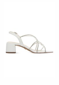 Weiße Sandalen mit Absatz und Riemchen-Design, ausgestattet mit Verzierungen und einem stabilen Blockabsatz. Glatte Textur und offene Zehenpartie.