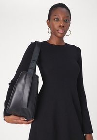 Calvin Klein Jeans CK INTARSIA  - Stickad klänning - black