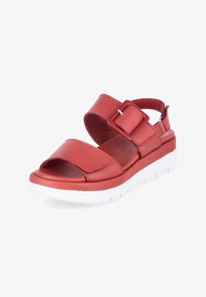 Sandalia roja de punta abierta con tiras anchas, hebilla ajustable, suela acolchada y suela exterior blanca y gruesa para uso informal.