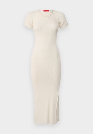 Oficialia, jauki trumpos rankovės, apvaliu kaklu, išskirtiniu siluetu ir šonine plyšio detale. Lygus tekstūra.