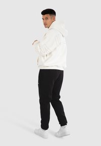 Smilodox HOLLOW BRAIL - Sweat à capuche - creme