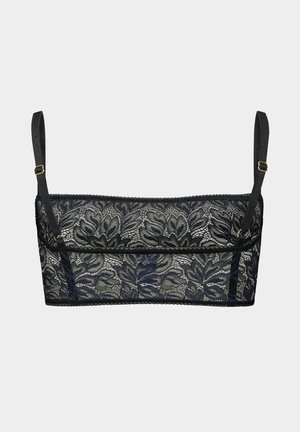 Zwarte kanten bralette met bloemmotieven, verstelbare bandjes en een gegolfde rand. Lichtgewicht stof met een zachte textuur.
