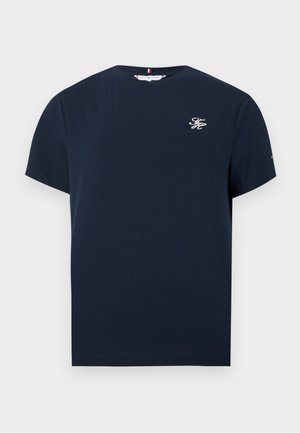 T-shirt bleu marine col rond manches courtes avec petit logo blanc "TH" sur la poitrine gauche et un petit détail sur la manche.