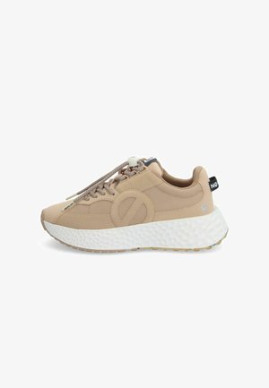 Beige sneaker with a textured synthetic upper, round toe, and thick white foam sole. Features tonal laces and a pull tab on the back.