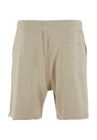 Beige katoenen shorts met een gestructureerd oppervlak, voorzien van een elastische tailleband en een enkele achterzak. Eenvoudig ontwerp zonder patronen.