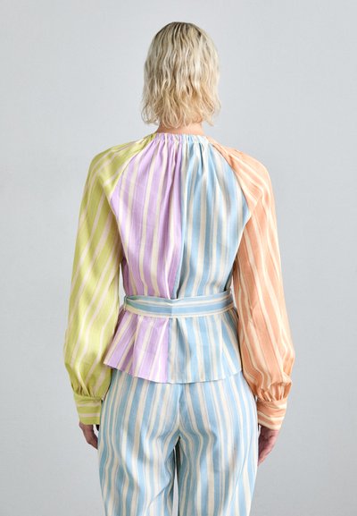 Striped blouse in pastel colors—lime green, lilac, peach, and sky blue with billowing sleeves and a fitted waist, showcasing a soft fabric texture.