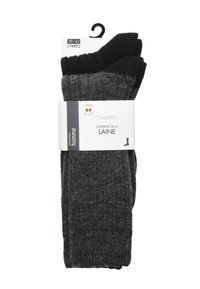 Deux paires de chaussettes en gris foncé et noir, au design tricoté texturé, avec un emballage étiqueté indiquant le contenu en laine et la plage de tailles 39/42.