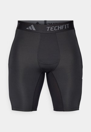 Pantalones cortos deportivos negros hechos de un tejido suave y elástico. Presentan una cinturilla ancha con marca y costuras planas para mayor comodidad y durabilidad.