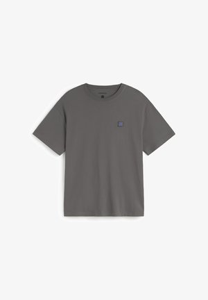 Gray cotton t-shirt with short sleeves, crew neck, and a small blue logo patch on the front. Smooth texture and relaxed fit.