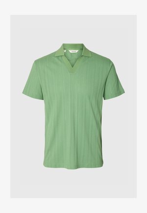 Green short-sleeve knit polo shirt with a textured vertical pattern and open V-neck collar.