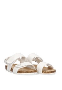 Sandalias de cuero blanco con suela de corcho, que cuentan con correas ajustables y una plantilla acolchada para mayor comodidad. Textura suave y diseño minimalista.