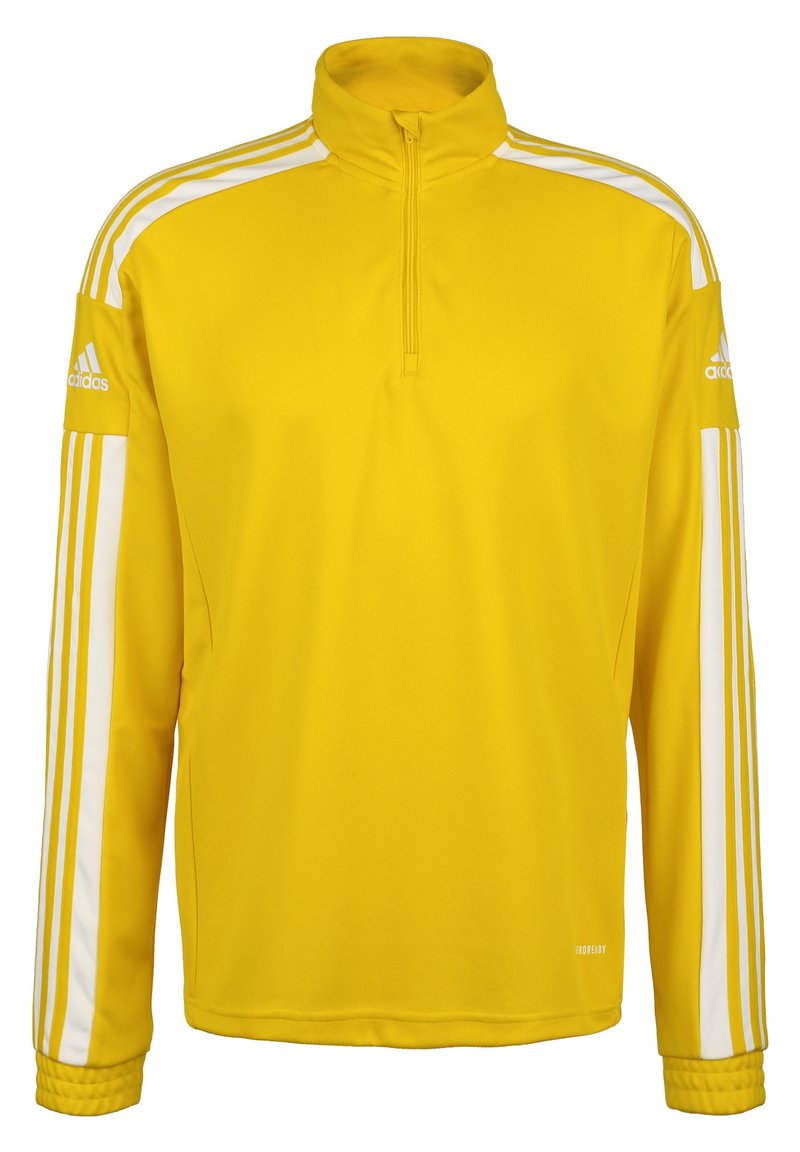 Pull-over de sport jaune avec un col zippé à moitié, des rayures blanches sur les côtés, des poignets côtelés et un logo brodé sur la manche gauche.