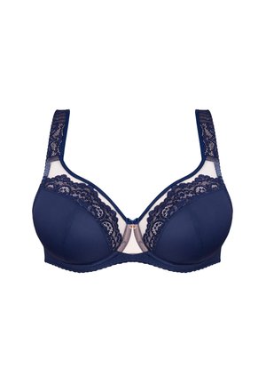 Reggiseno blu navy con bordi in pizzo, pannelli in rete e ferretto. Presenta spalline larghe e un fiocco decorativo al centro davanti. Texture liscia.