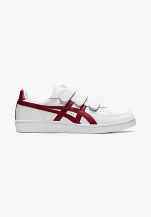 Baskets blanches avec trois bandes Velcro blanches et des rayures rouges le long du côté et du talon arrière.