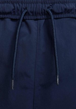 Marineblå shorts med elastisk talje, der har en struktureret snøre og glat stof.