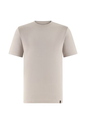 T-shirt beige à manches courtes avec col rond et une petite étiquette noire en bas de l'ourlet, présenté sur un fond blanc.