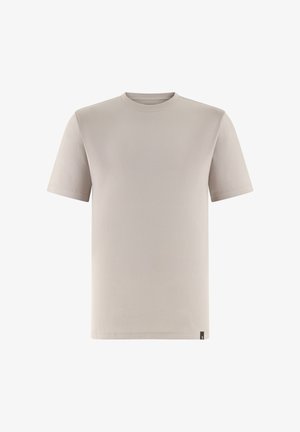 T-shirt beige à manches courtes avec col rond et une petite étiquette noire en bas de l'ourlet, présenté sur un fond blanc.