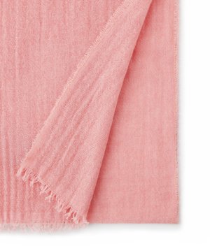 Soft pink woven fabric with loose weave, a folded corner, and fringed edges on a white background.