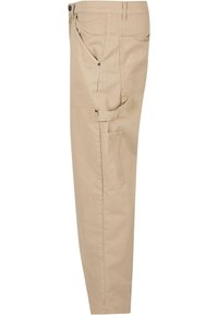 Beige cargobroek met meerdere zakken, knoop- en ritsluiting, taps toelopend ontwerp en zachte katoenen stofmix.