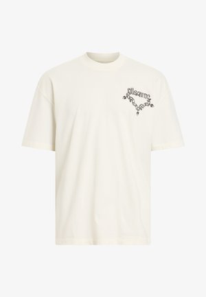 Light beige cotton t-shirt with a crew neckline, short sleeves, and a black graphic design on the left chest area featuring a chain motif.