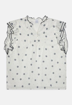 Blouse blanche à manches courtes avec imprimé floral bleu marine, manches volantées, décolleté en V et détail de boutons. Texture légère avec un motif subtil.