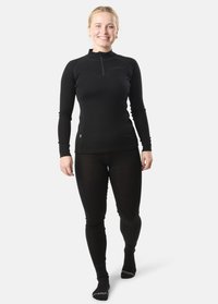 Black long-sleeve thermal top with a half-zip collar, fitted design, and matching black leggings. Textured fabric with seamless construction.