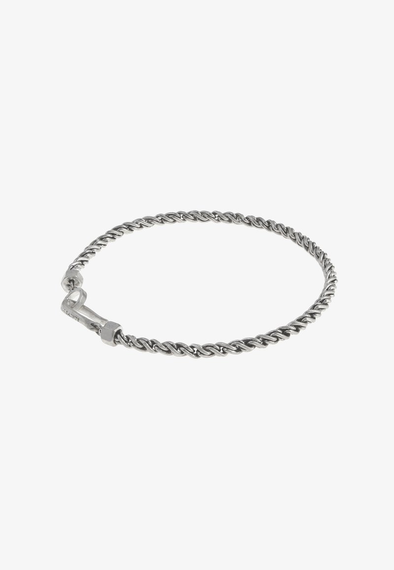 Pulsera de plata retorcida con un diseño suave y redondeado; cuenta con un cierre con marca visible y una superficie texturizada.