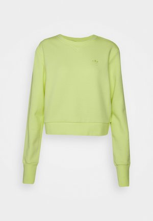 Korte sweatshirt van licht neon groene stof; heeft een V-hals, lange mouwen en een klein logo gedrukt op de borst.