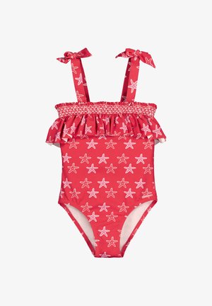 Bañador rojo de una pieza con patrón de estrellas de mar blancas, borde superior con volantes y tirantes atados en los hombros.