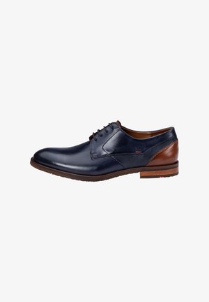 Navy leather shoe with brown accents, featuring a smooth finish, lace-up design, and textured panel on the side. Brown rubber sole.