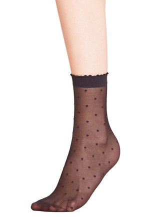 Black sheer ankle socks with a scalloped top edge, featuring evenly spaced brown polka dots throughout the fabric.