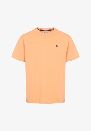 Tricou din bumbac, de culoare portocaliu deschis, cu mâneci scurte și decolteu rotund, având un logo mic brodat pe pieptul stâng. Textură fină.