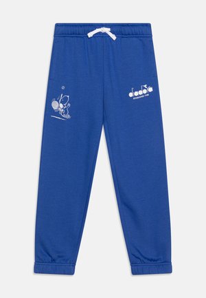Blue cotton sweatpants with elastic waistband and drawstring, featuring a white cartoon print and logo on the left leg.