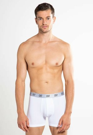 Hvide bokserbriefs med en grå talje med "CR7" branding. Fremstillet af glat stof, designet inkluderer en støttende frontpung.