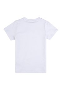 T-shirt bianco in cotone con maniche corte, colletto rotondo e tre bottoni a pressione sulla parte superiore della schiena. Tessuto liscio, senza motivi.