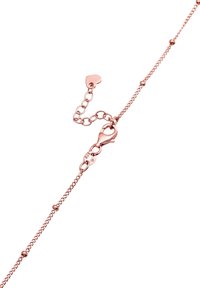 Bracciale a catena in oro rosa con chiusura a gancio e piccole perline rotonde lungo la lunghezza, dotato di una catena regolabile per la vestibilità.