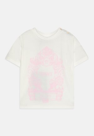 T-shirt en coton blanc à manches courtes et col rond. Présente un motif graphique rose et trois boutons dorés à l'épaule.